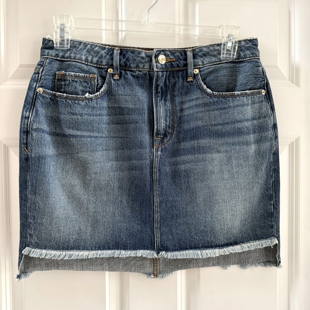 Good American Step Hem Jean Denim Mini Skirt. Distressed Medium Wash. Size 8/29.